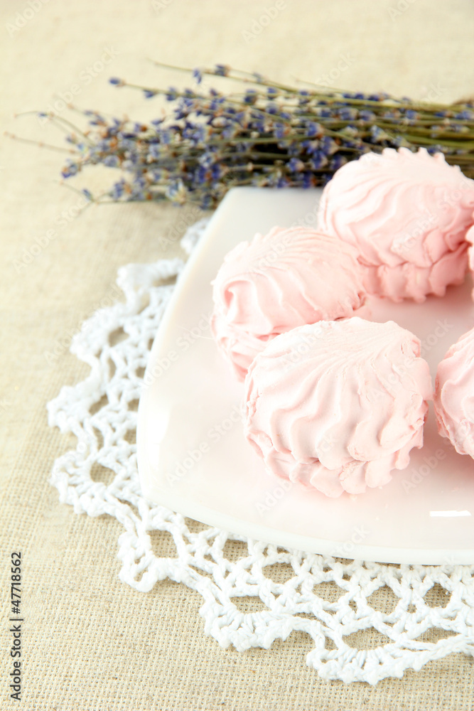 Marshmallows on plate on light background Marshmallows on plate on light background