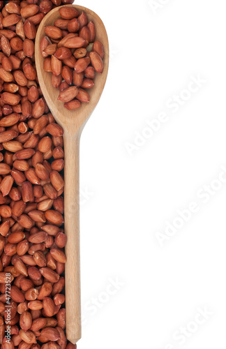 Peanuts nuts in a wooden spoon