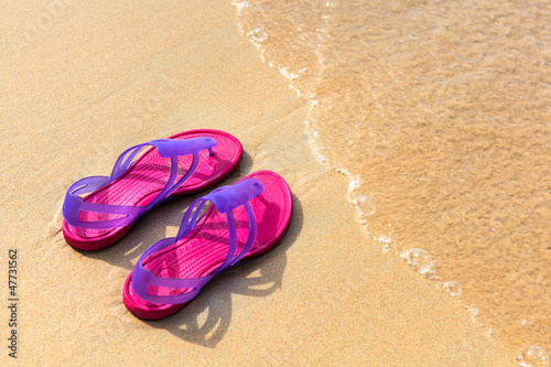 Sandals on the beach - concept image