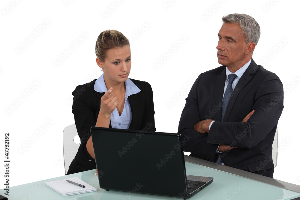 Boss and hiss young employee working together Boss and hiss young employee working together