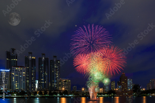 Fireworks over building cityscape,