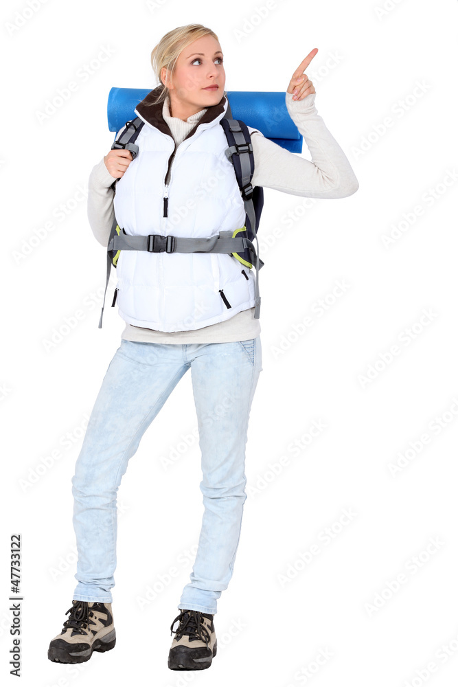 Woman carrying hiking backpack Woman carrying hiking backpack