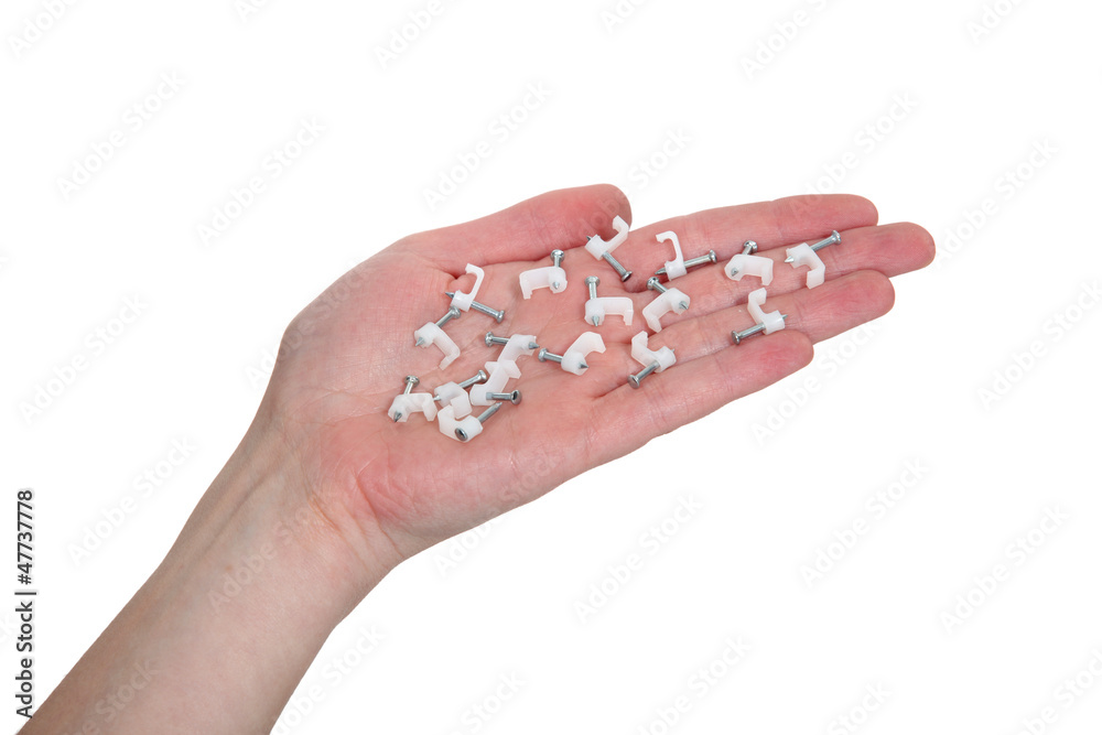 hand holding cable clips for fastening cable hand holding cable clips for fastening cable
