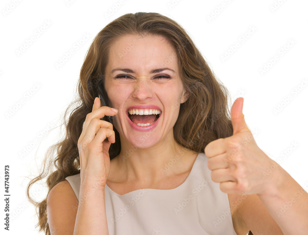 Portrait of happy woman talking mobile and showing thumbs up Portrait of happy woman talking mobile and showing thumbs up