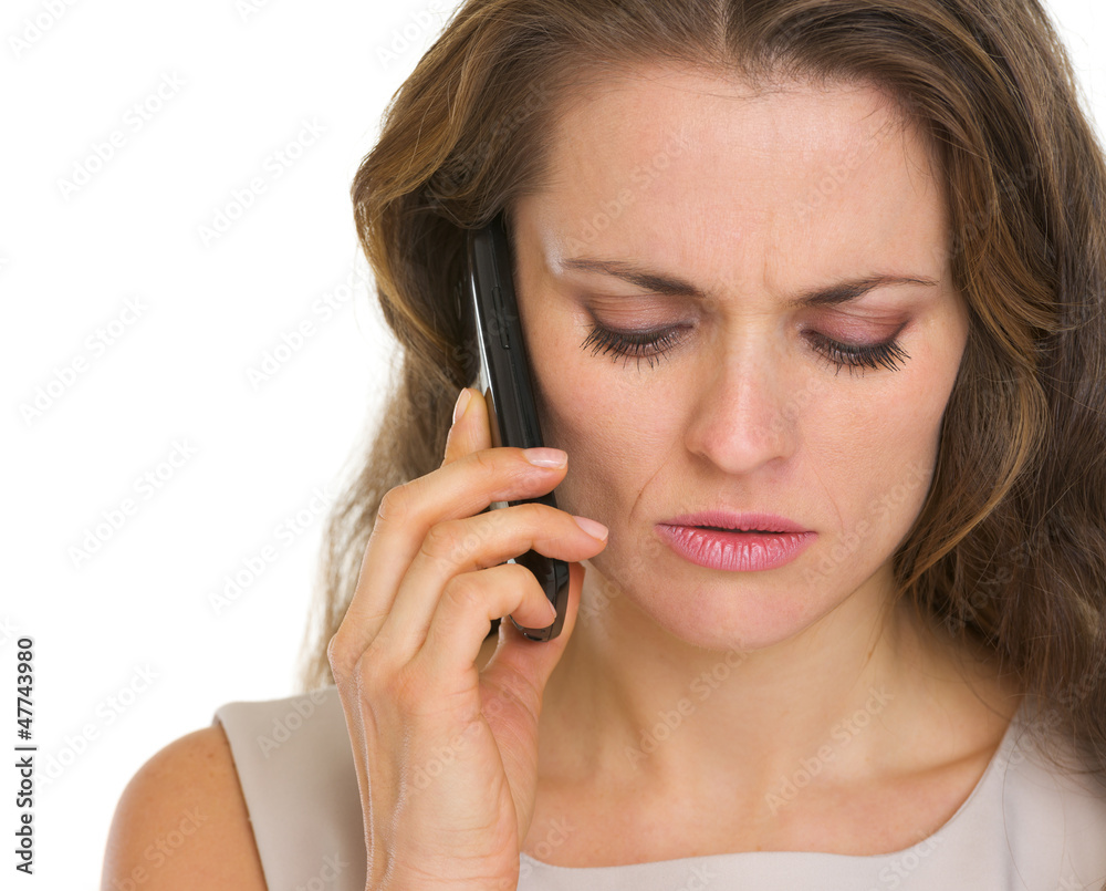 Portrait of concerned woman talking mobile phone Portrait of concerned woman talking mobile phone