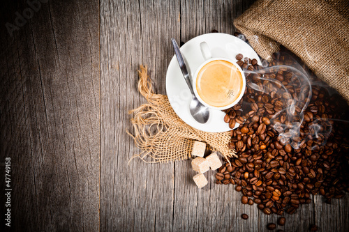 Coffee still life on wooden surface, upper view