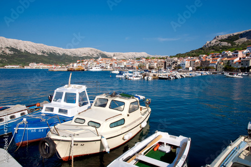 Boats on port at Baska background Baska old town - Krk - Croatia