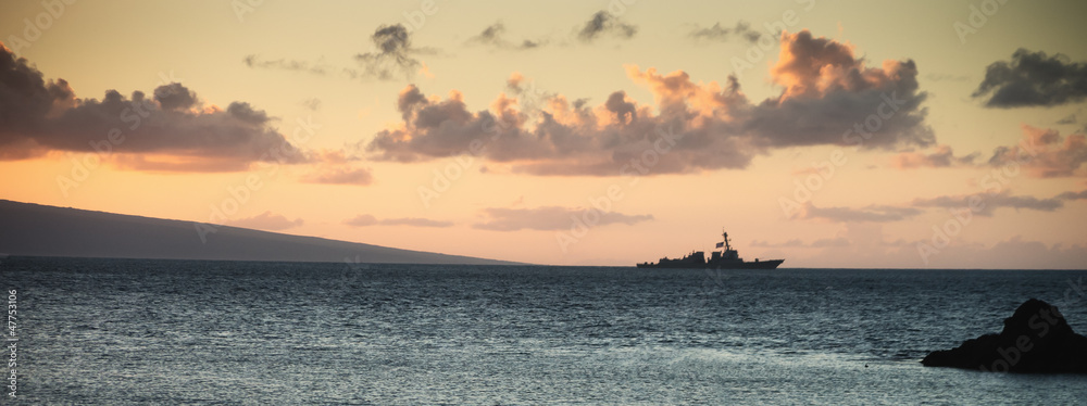 Fototapeta premium Us Navy Ship at Sunset