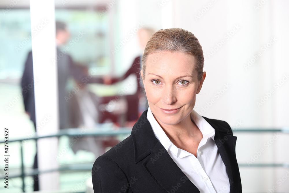 Blonde woman in front of rail Blonde woman in front of rail