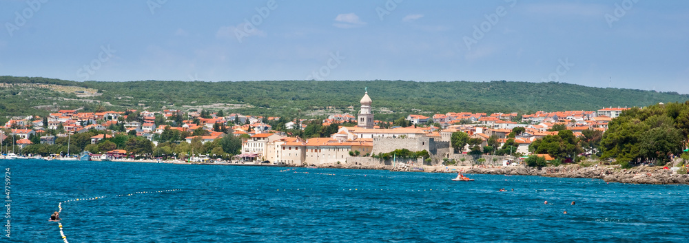 Panoramic view of Krk old town and hills from the sea - Croatia