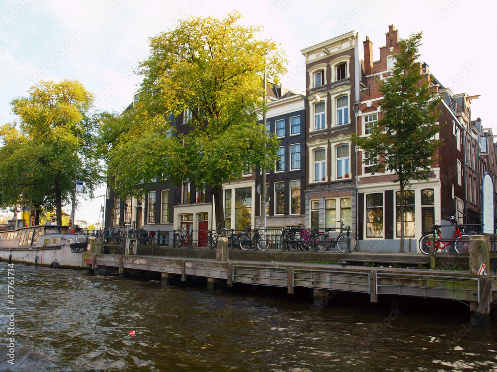 Amsterdam canals and typical houses with clear summer sky
