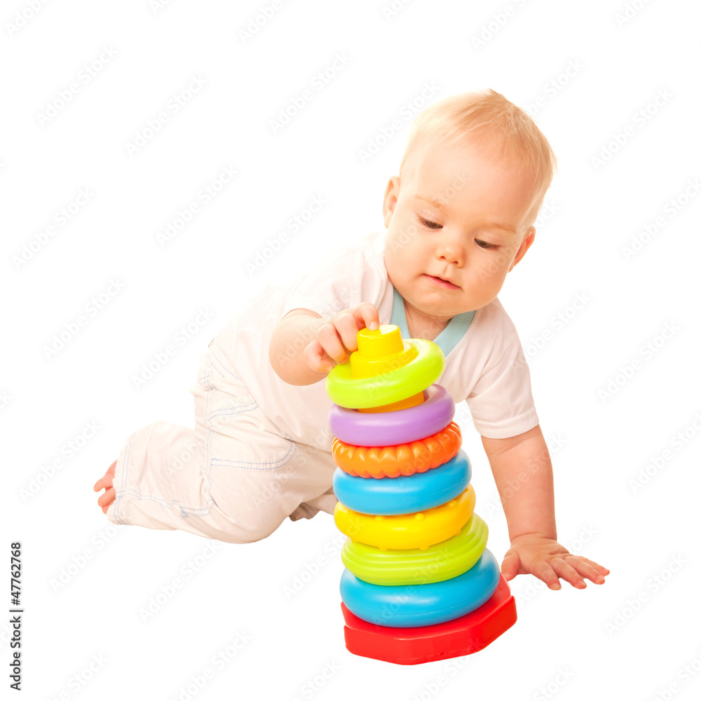 Baby playing with toys. Isolated on white background. Baby playing with toys. Isolated on white background.