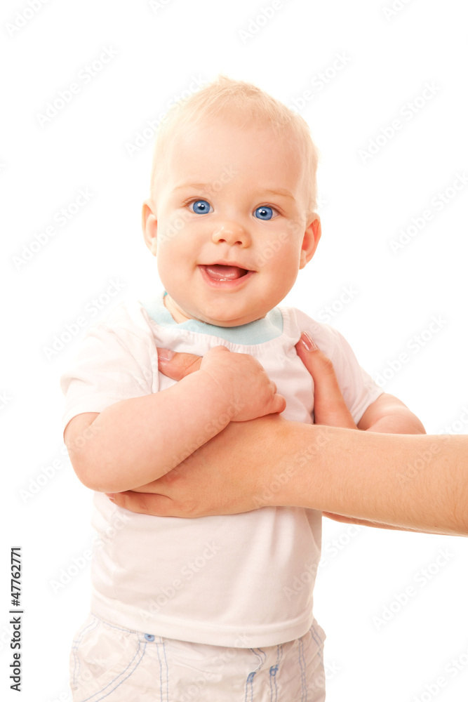 Happy blue-eyed baby standing with mother's arms Happy blue-eyed baby standing with mother's arms