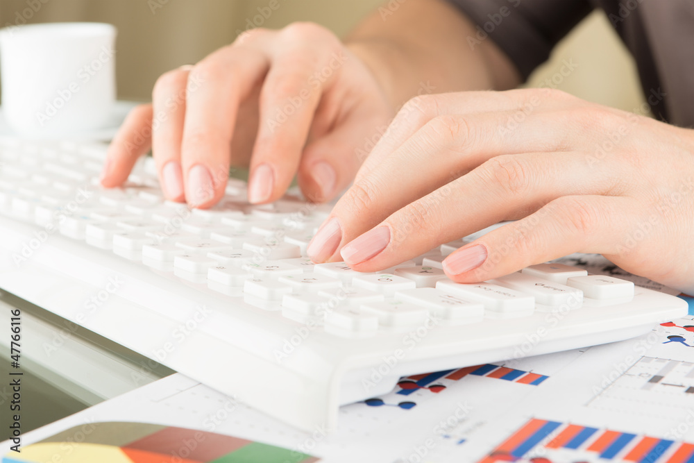 Typing on keyboard. Woman hands, close view Typing on keyboard. Woman hands, close view