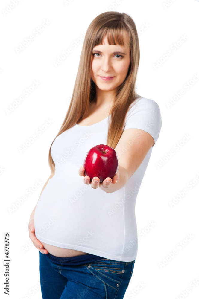 Beautiful pregnant woman holding a red apple Beautiful pregnant woman holding a red apple