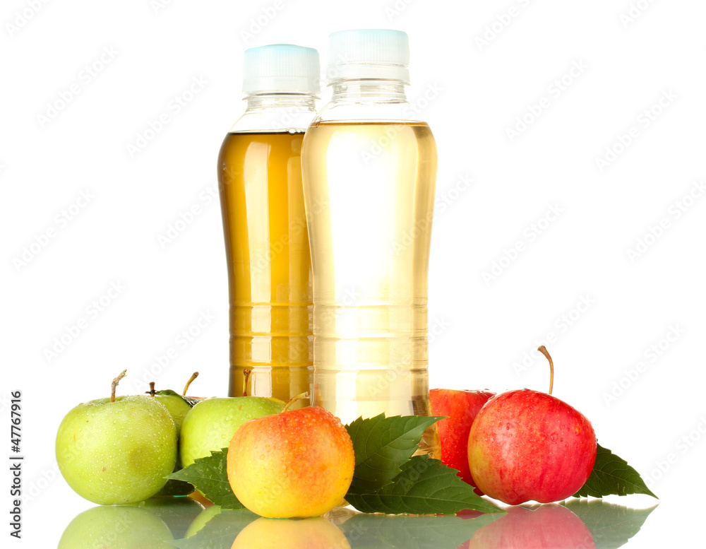 two bottles of juice with sweet apples, isolated on white two bottles of juice with sweet apples, isolated on white