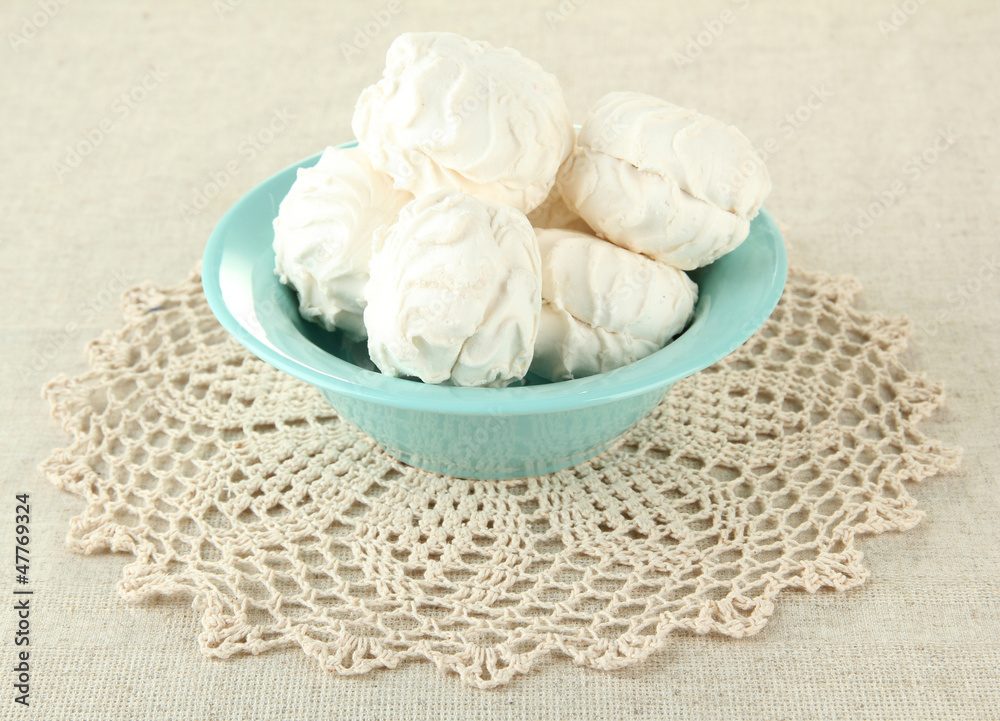 Marshmallows on color plate on light background Marshmallows on color plate on light background