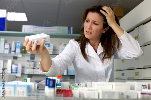 Desperate pharmacist working in pharmacy