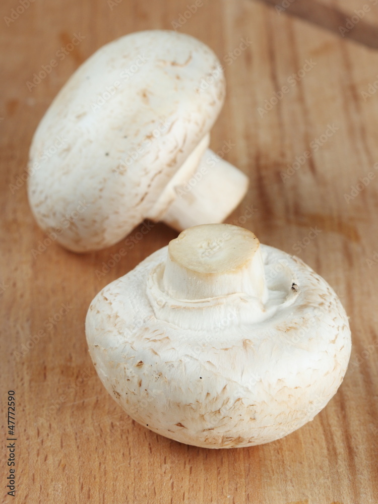 Fresh mushrooms on the kitchen board