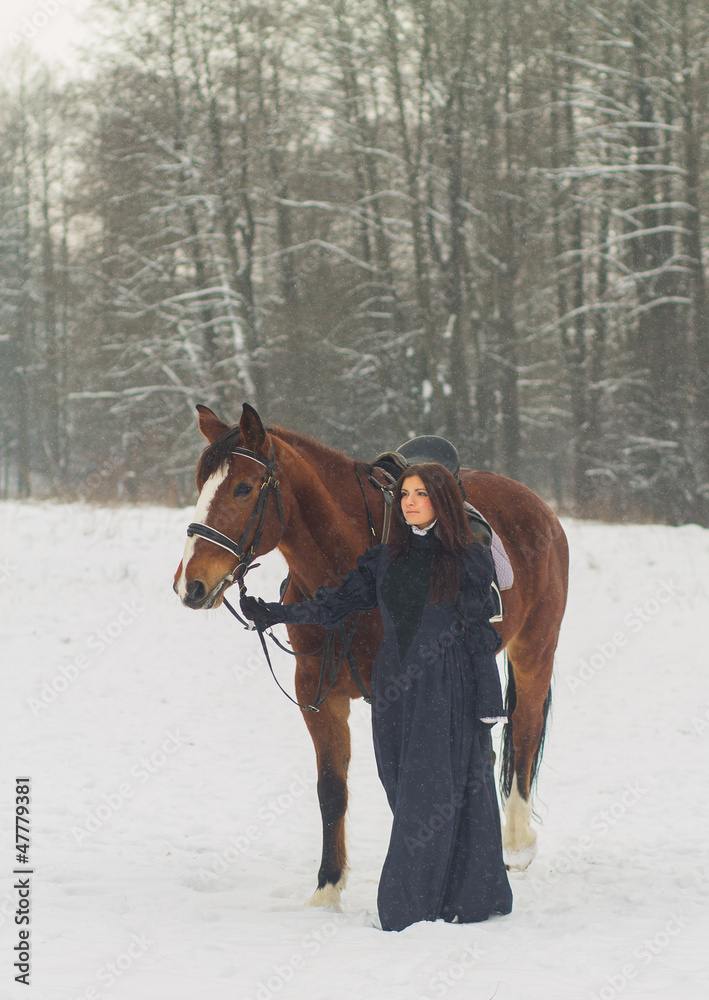 Beautiful woman and horse in winter Beautiful woman and horse in winter
