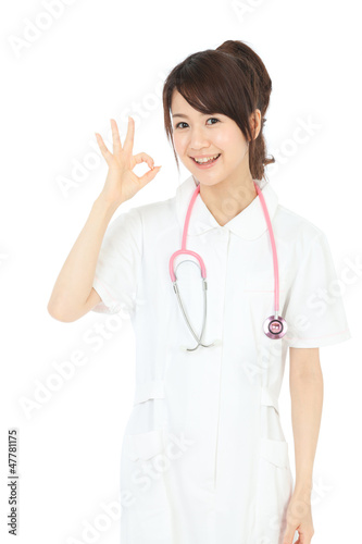 Beautiful asian nurse on white background