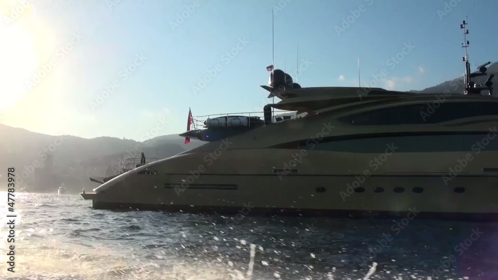 Close up of a yacht while passing by on a boat Close up of a yacht while passing by on a boat
