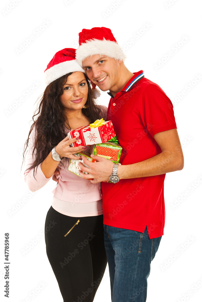 Happy Xmas couple holding presents Happy Xmas couple holding presents
