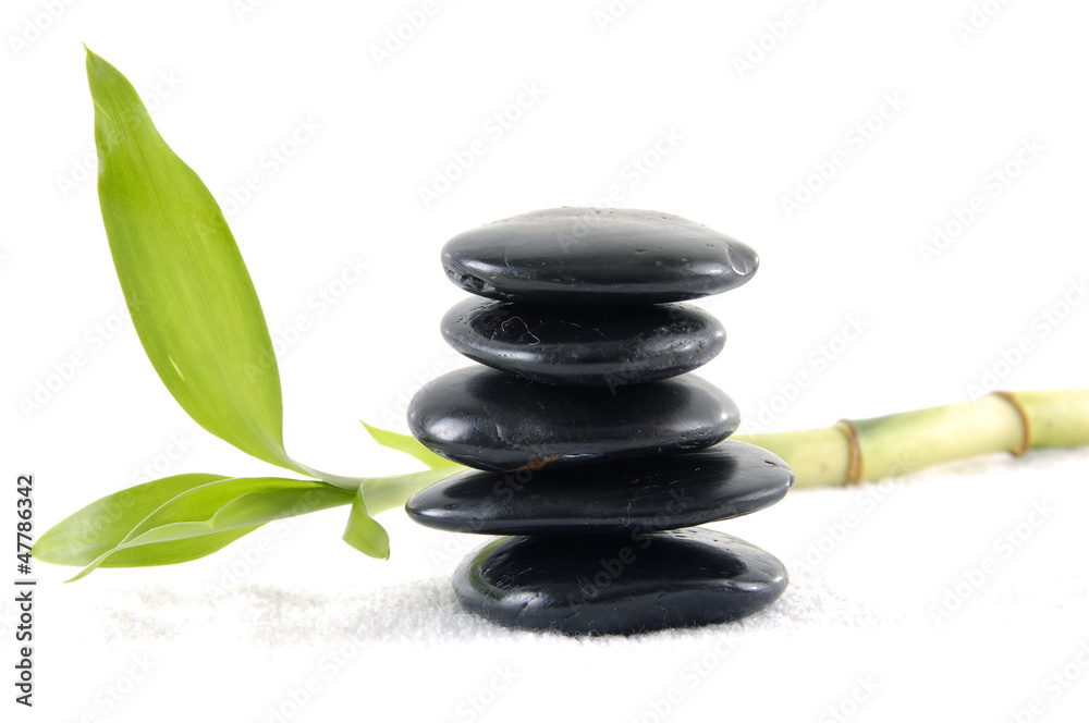 Stacked of black stones with bamboo leaf Stacked of black stones with bamboo leaf