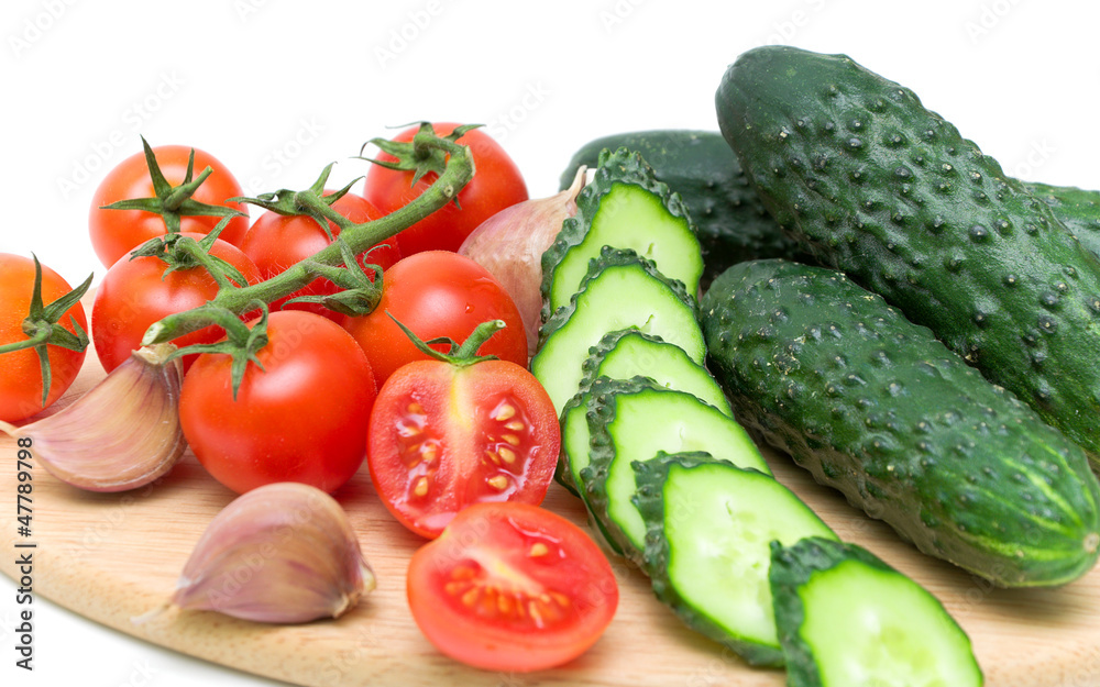 tomatoes and cucumbers on the cutting board tomatoes and cucumbers on the cutting board