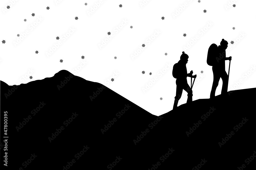 Obraz premium Mountain climbing in winter, hiking couple with rucksacks