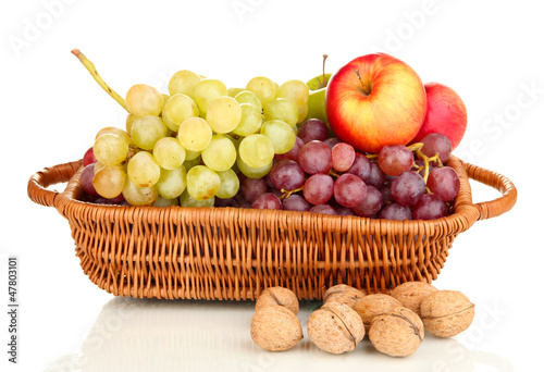 Grape in basket with nuts isolated on white