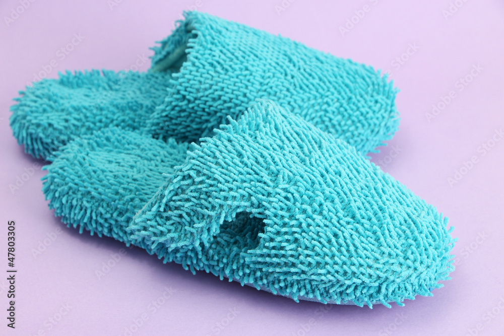 Fototapeta premium bright slippers, on purple background