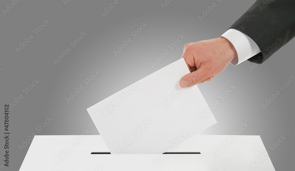 Man hand down the ballot in the ballot box Man hand down the ballot in the ballot box