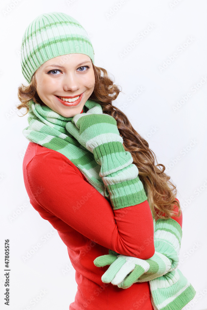 Young woman wearing winter hat and warm scarf Young woman wearing winter hat and warm scarf