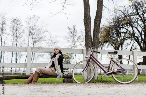 Young woman with bicycle