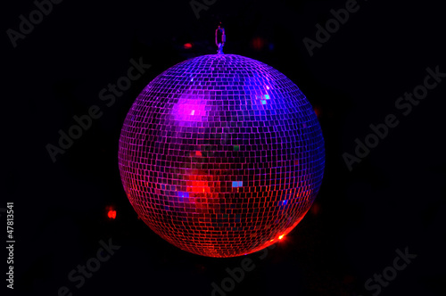Party light disco ball on dark background