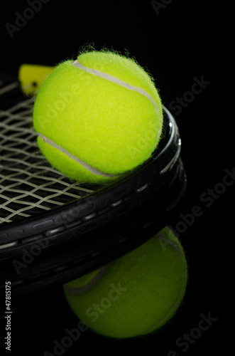 Tennis balls and racket © skyfotostock
