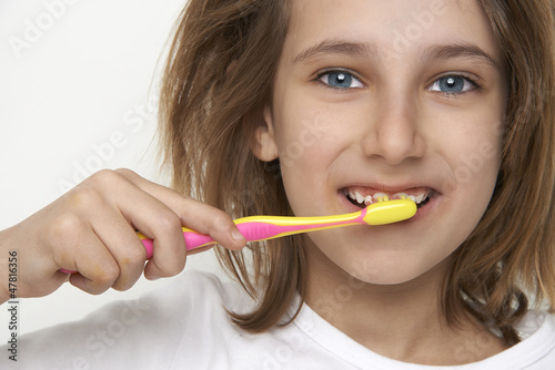 child brushing tooth