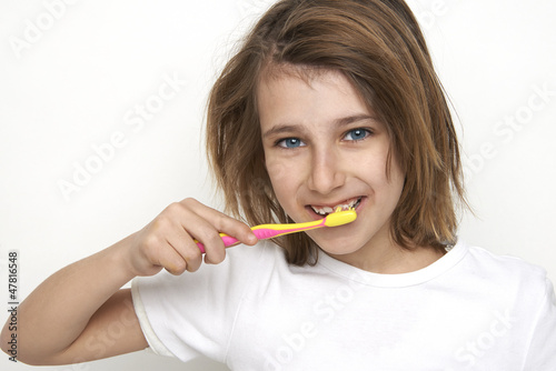 child brushing tooth