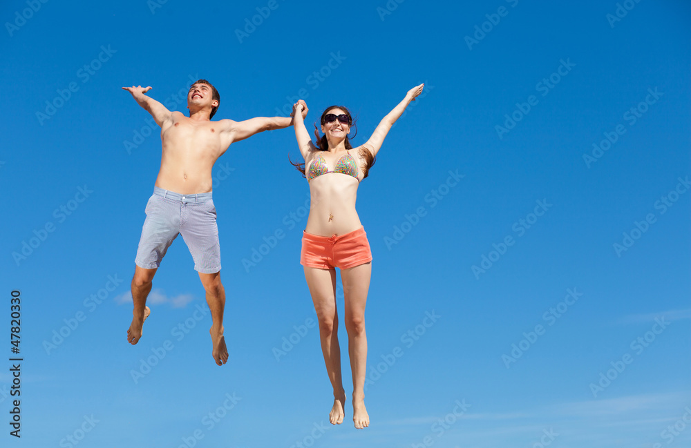 Happy Young Couple Together On The Beach Happy Young Couple Together On The Beach