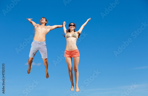 Happy Young Couple Together On The Beach