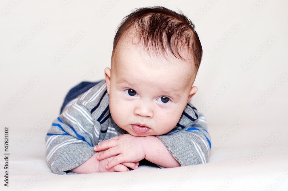 Portrait of the baby lying on a stomach (3 months) Portrait of the baby lying on a stomach (3 months)
