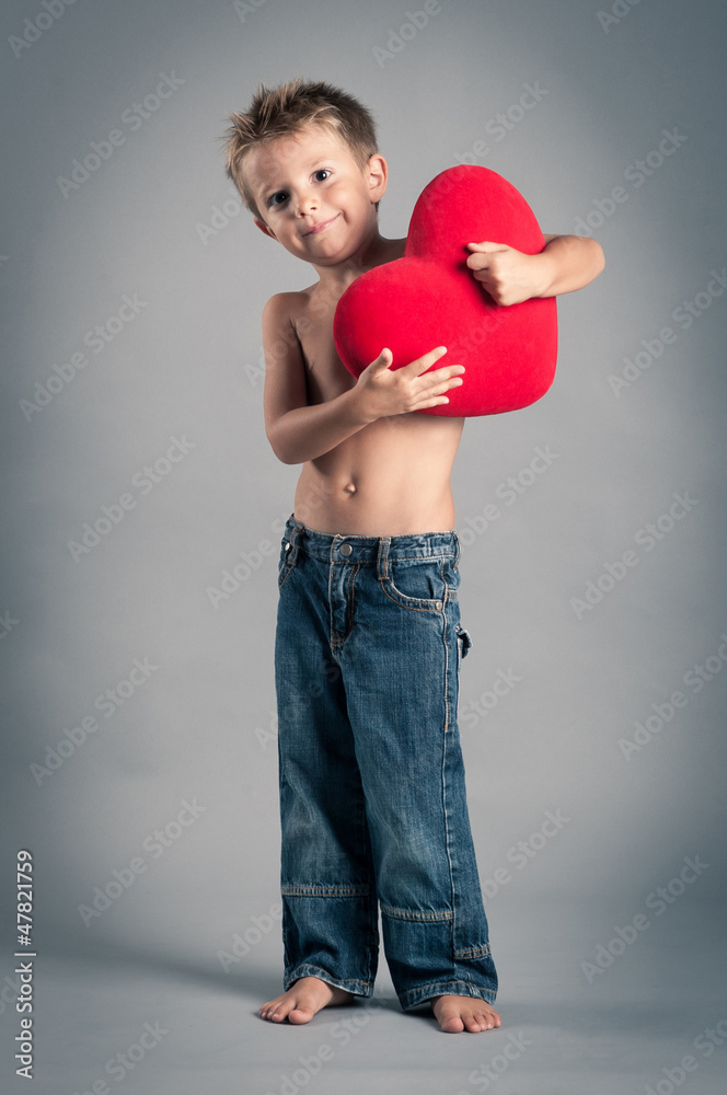 Little boy playing with red heart. Valentines Day concept. Little boy playing with red heart. Valentines Day concept.