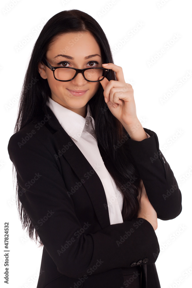 Portrait of young woman looking over glasses