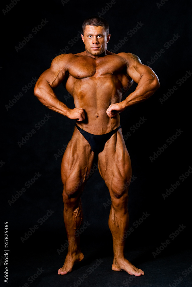 A male bodybuilder flexing his muscles A male bodybuilder flexing his muscles