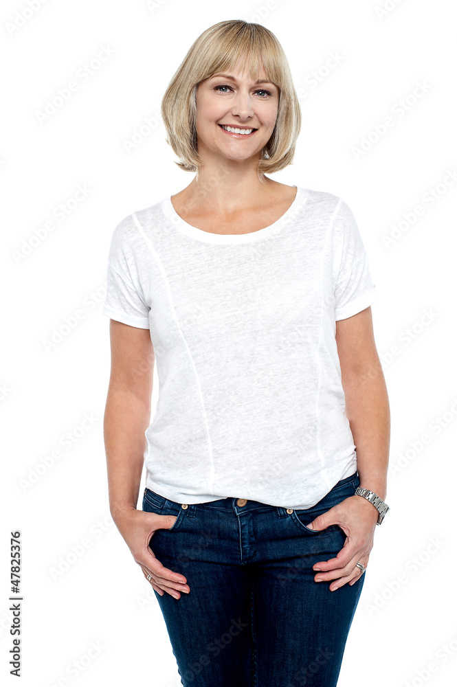 Middle aged woman in trendy clothing smiling at you Middle aged woman in trendy clothing smiling at you