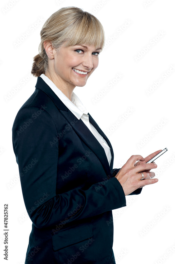 Female executive operating touch screen cellphone Female executive operating touch screen cellphone