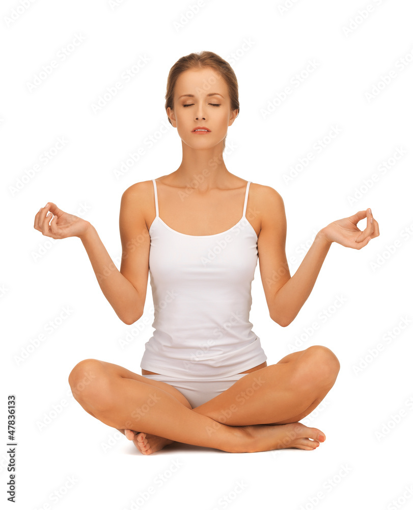 woman in undrewear practicing yoga lotus pose woman in undrewear practicing yoga lotus pose