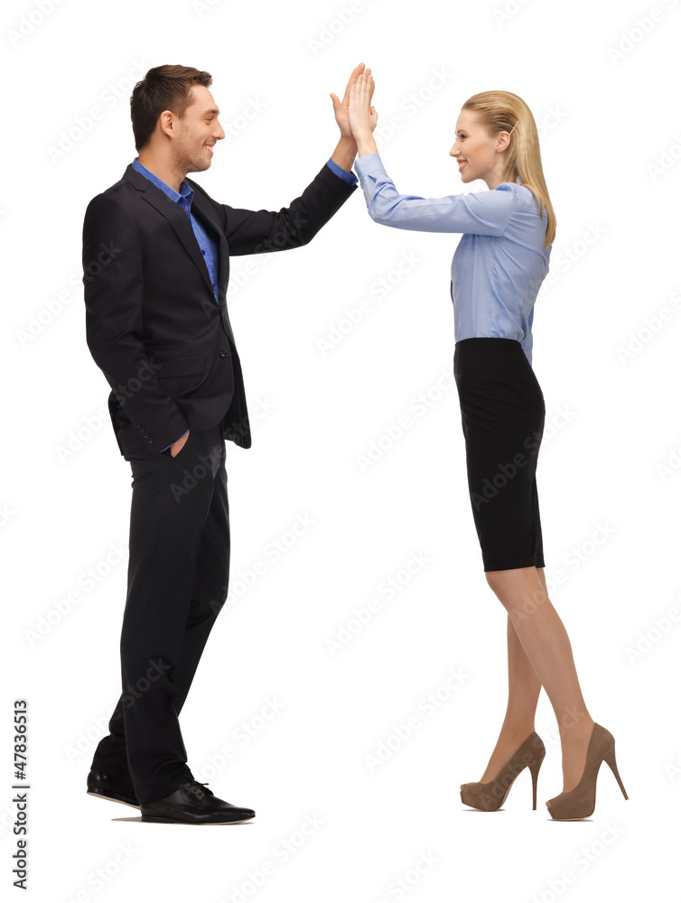 man and woman giving a high five man and woman giving a high five