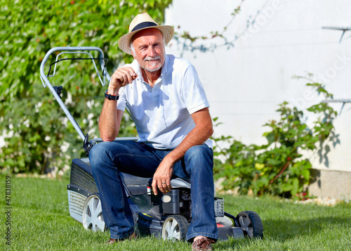 Senior man take a break after cuting the grass